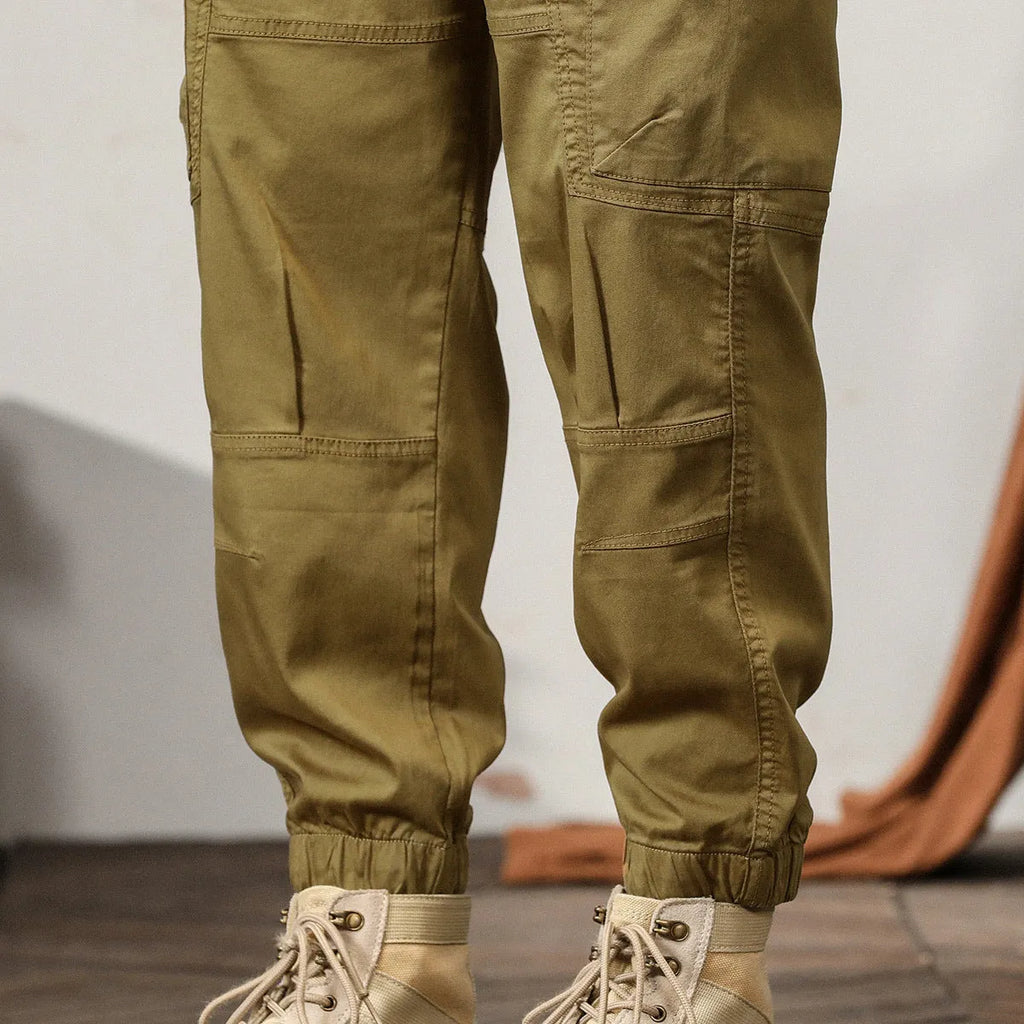 Men's tapered harem trousers in cotton with banded ankle and elastic waist in solid colour options.