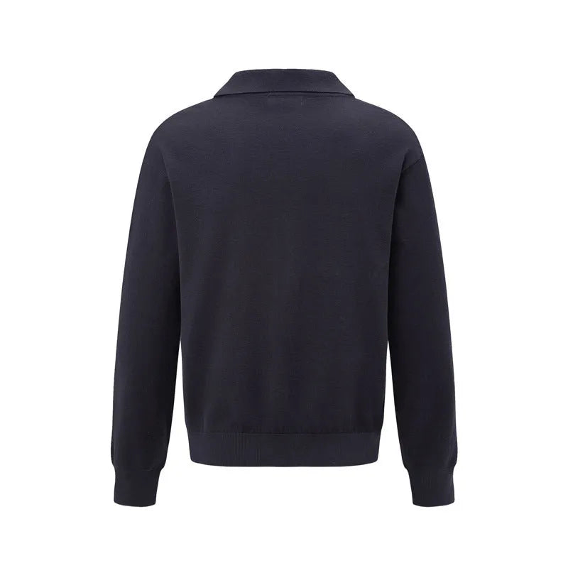 Loose black pullover sweater on a hanger, showing casual fit
