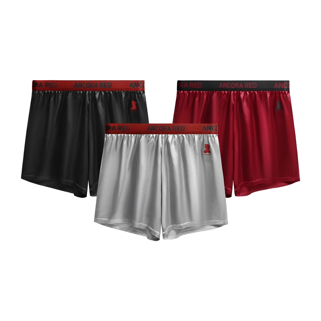 Solid colour men's boxer briefs in black, blue, brown, purple, red, and silver with mid waist design