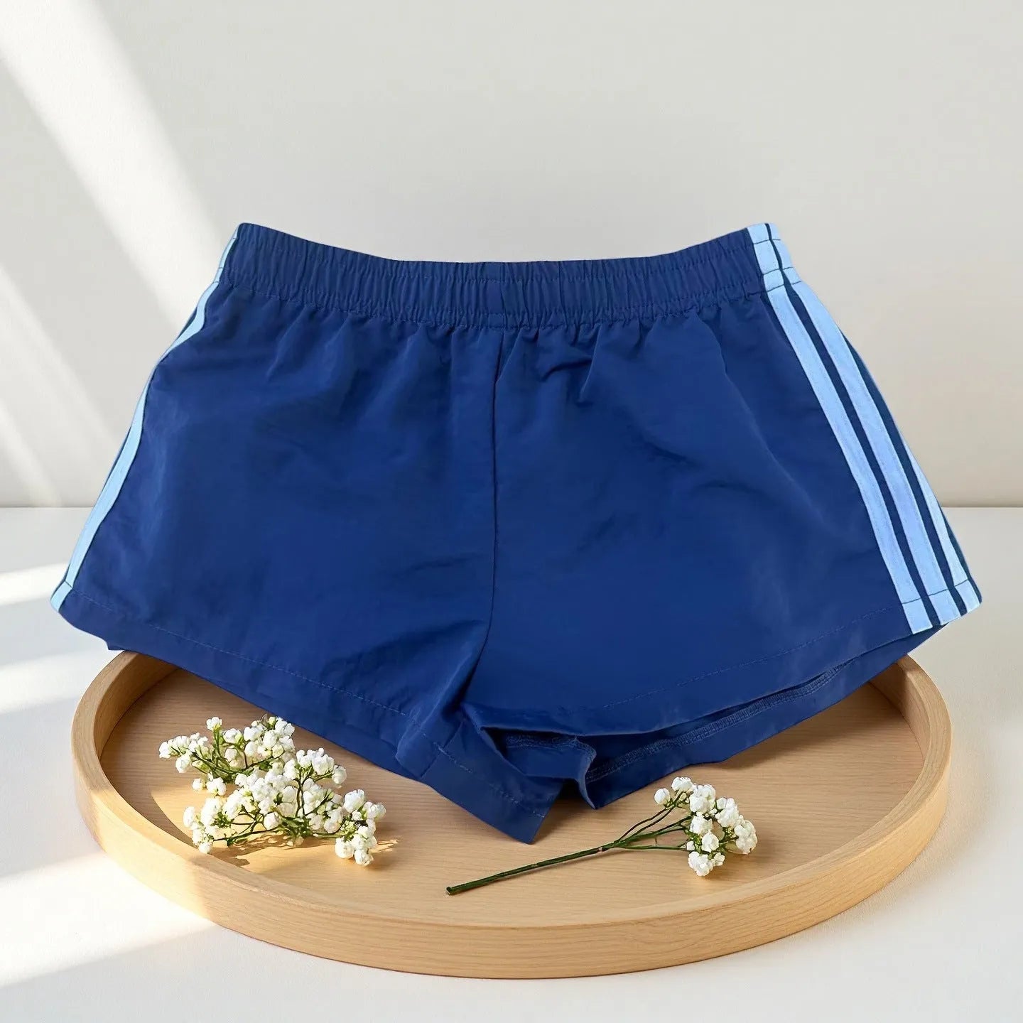 Navy blue men's nylon sport shorts with high-waist elastic waistband