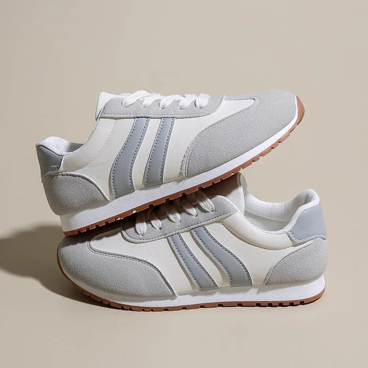 Blue and grey Cortez stripes casual sports shoes with round toe and flat rubber sole.