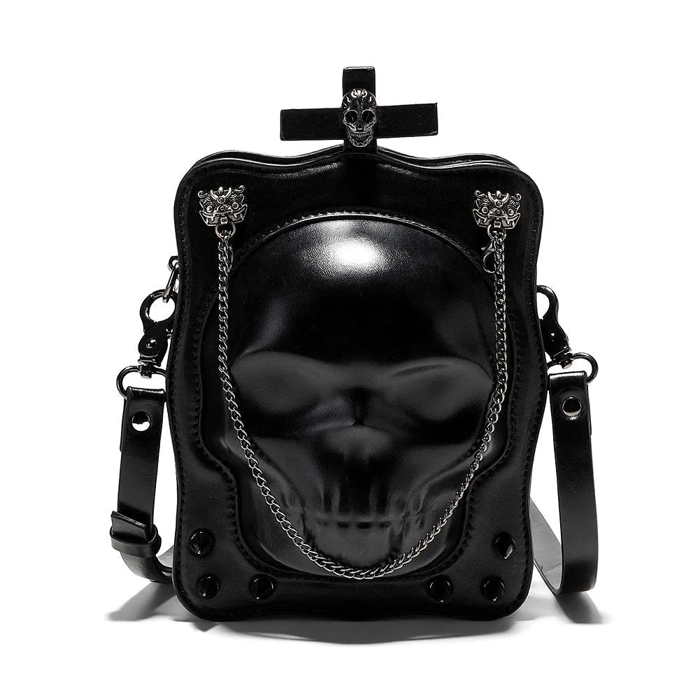 Black vertical square PU leather crossbody bag with embossed skull design, stitching, rivets, and a chain strap.