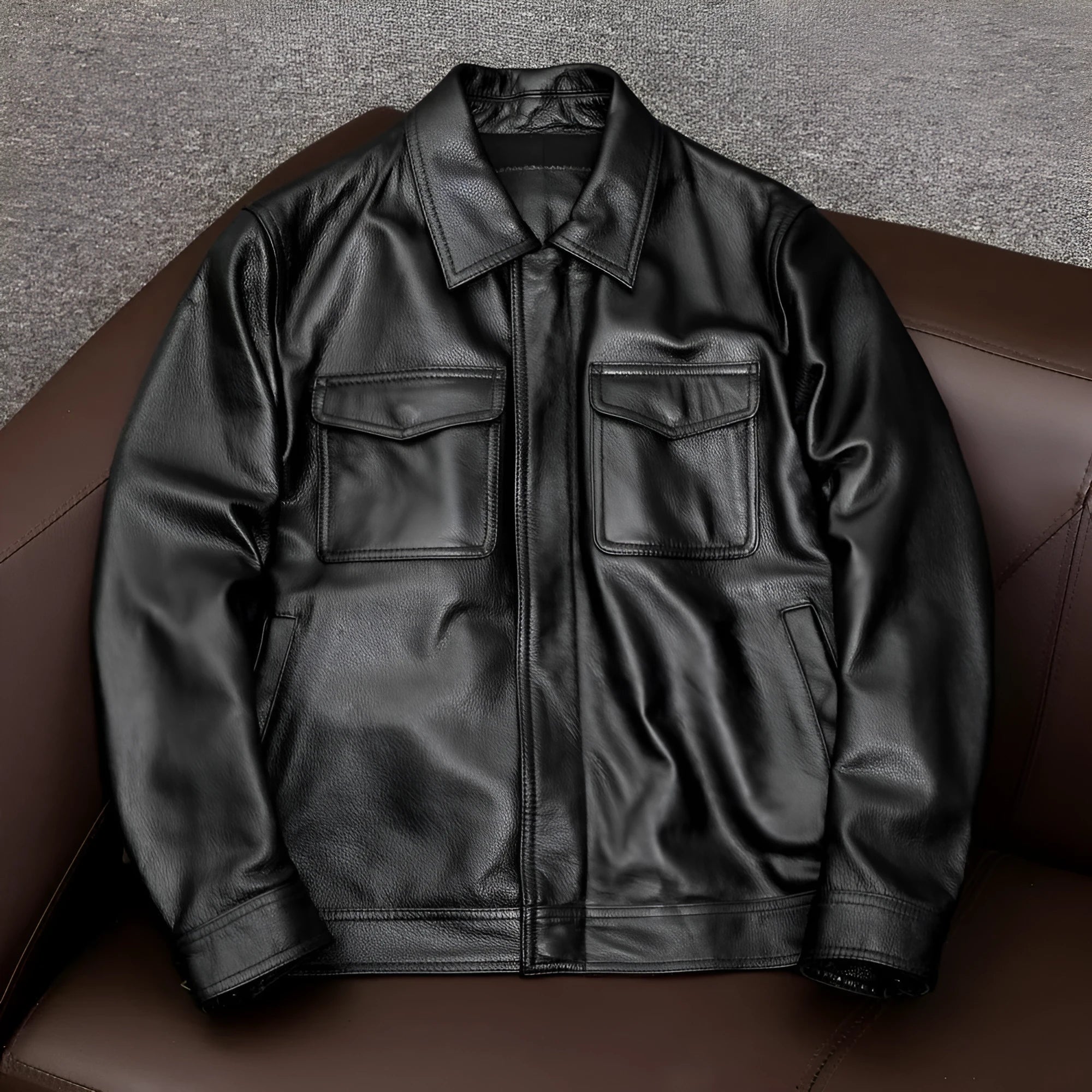 Men's black lapel leather jacket with side seam pockets in loose fit design