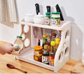 Foldable kitchen storage rack with multilayer shelves in white colour on countertop