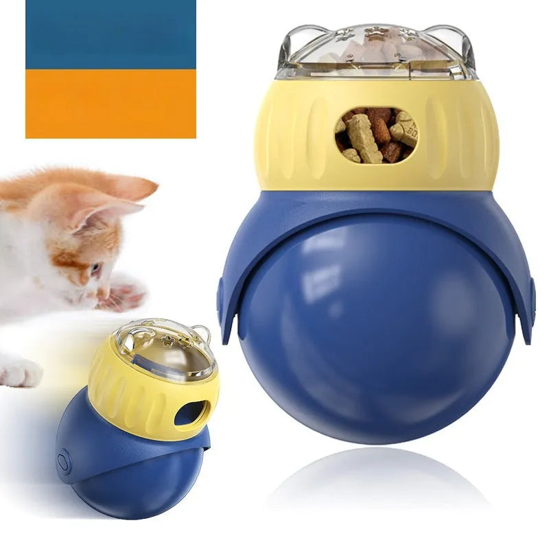Yellow and blue owl-shaped plastic tumbler cat puzzle feeder toy on a plain background.