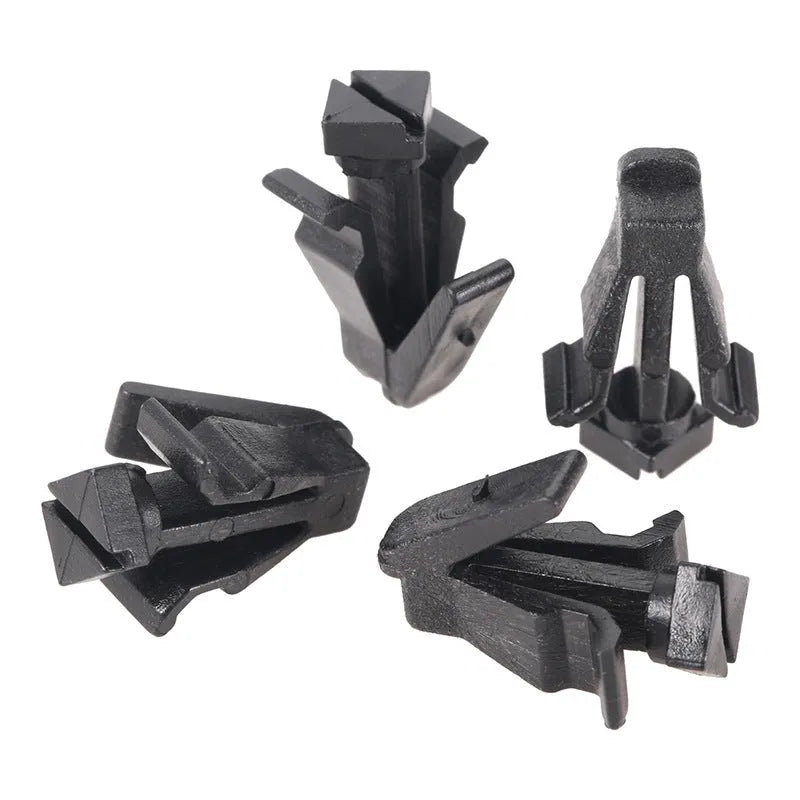 Black plastic automotive fastening clip for Nissan bumper or grille, part number 76882-0M060.