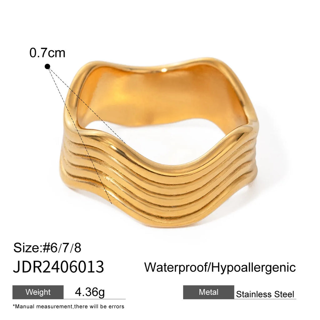 Stainless steel geometric wave ring for women in silver or gold finish.