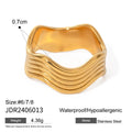 Stainless steel geometric wave ring for women in silver or gold finish.