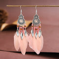 Round drop feather earrings in alloy with electroplated finish showing leaf shape and pattern details