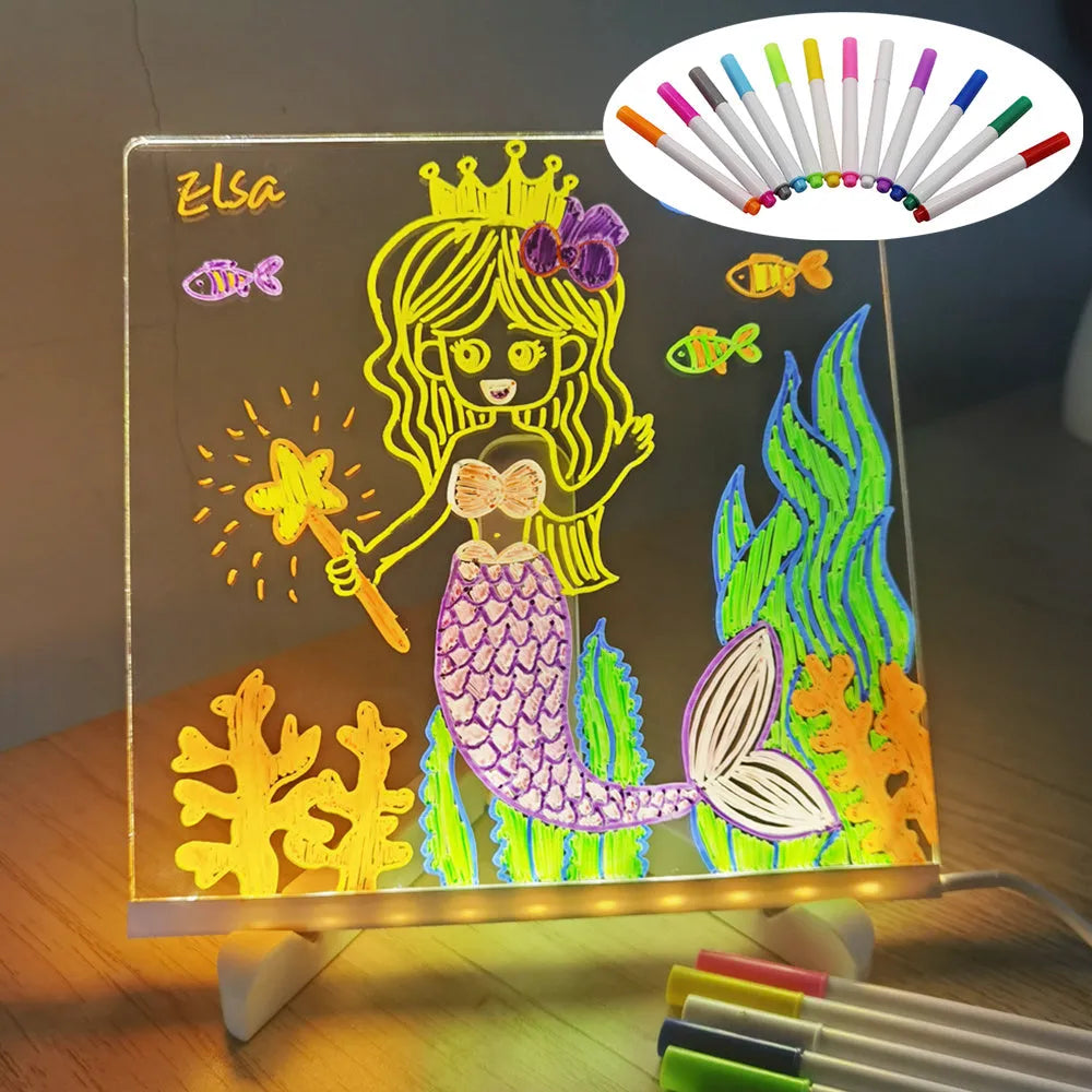 Acrylic LED message board night light on a desk with colourful handwritten notes glowing softly.
