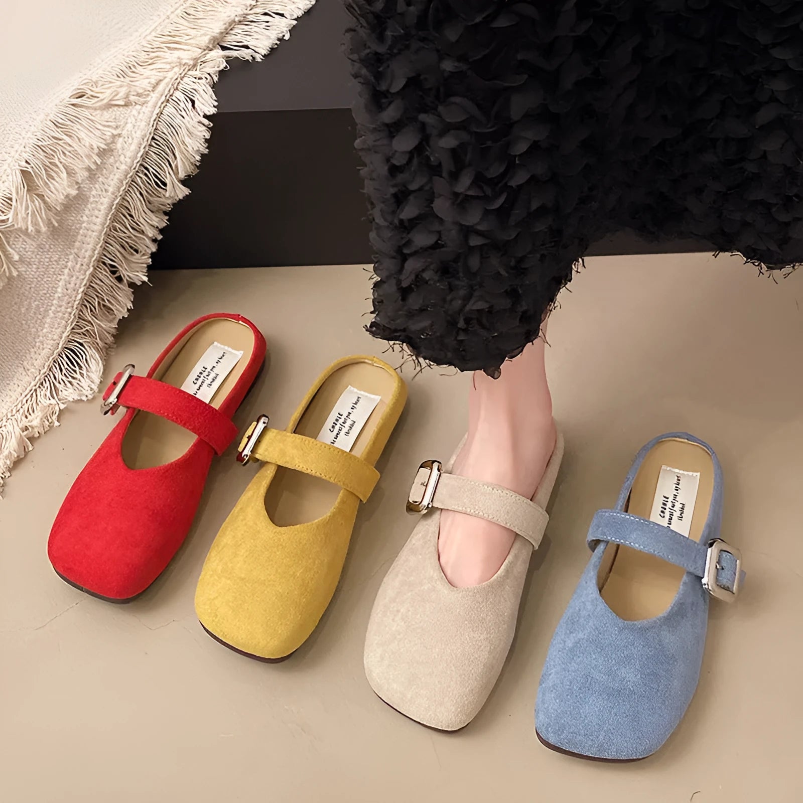 Women's flat closed-toe half slipper in a choice of colours, showing square toe and rubber sole.
