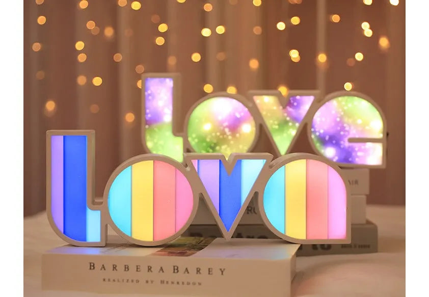 Rainbow halo style LED LOVE decorative light measuring 35.5cm wide