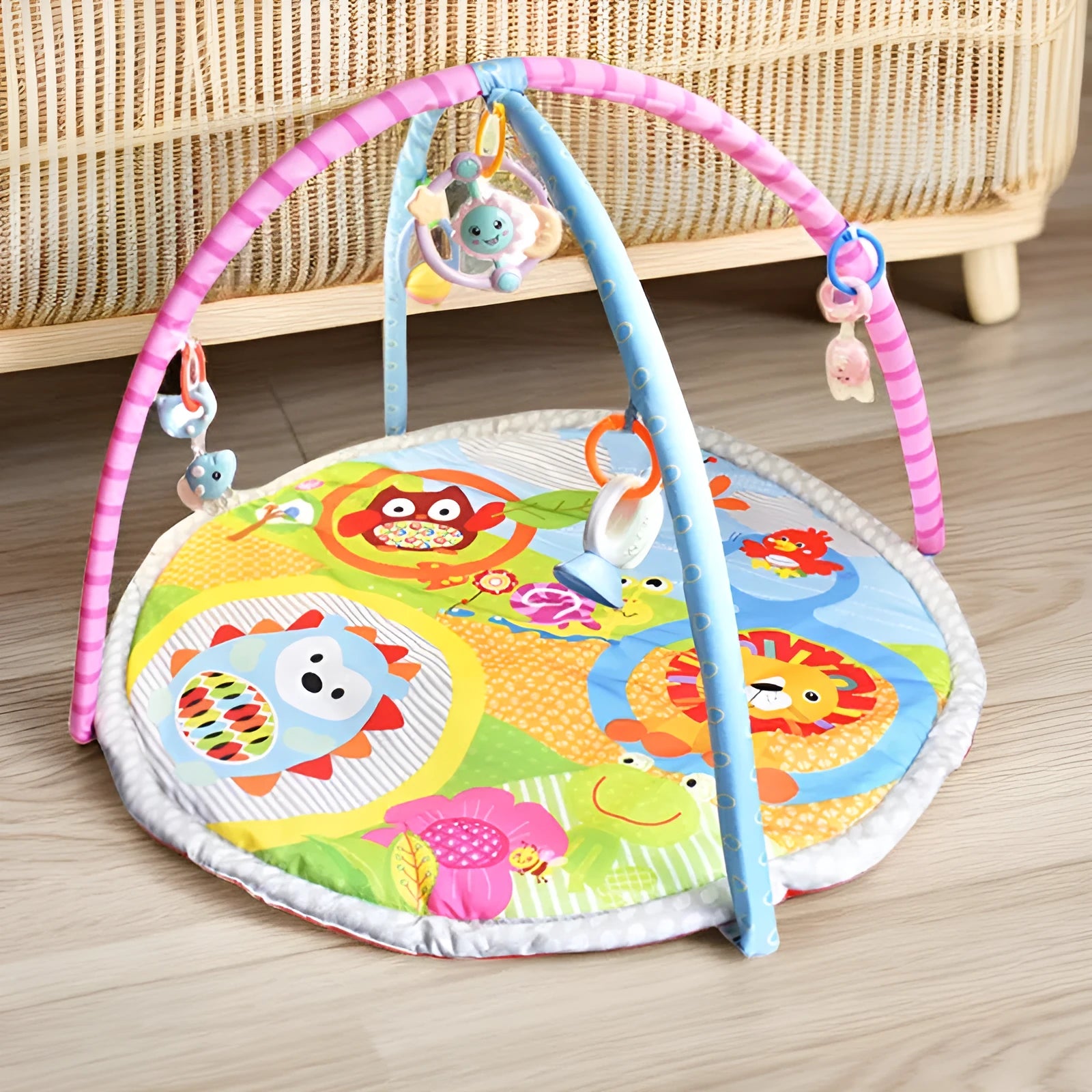 Colourful baby gymnastic blanket with velvet fabric and animal toys for crawling play.
