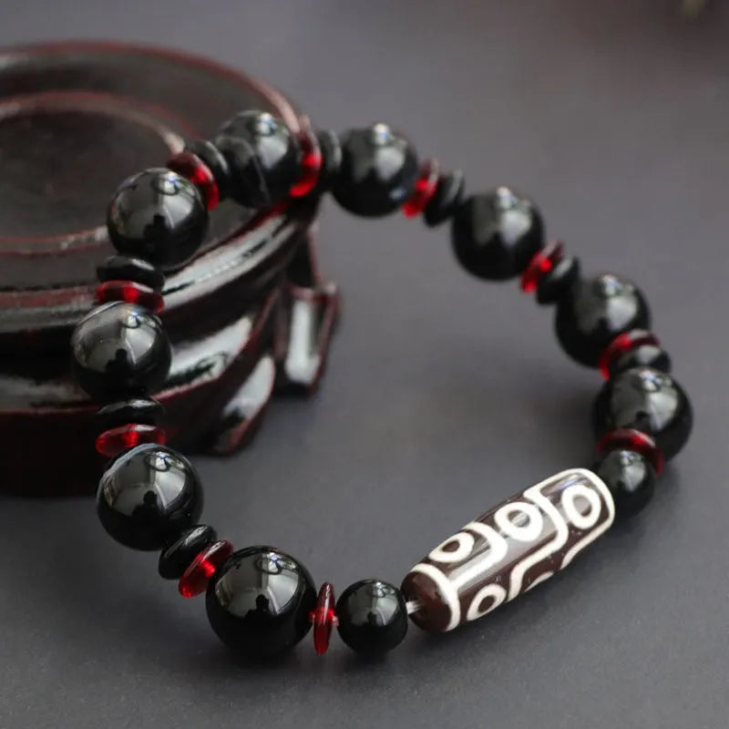 Black agate dzi bead bracelet with 11mm round beads in hand-woven geometry pattern