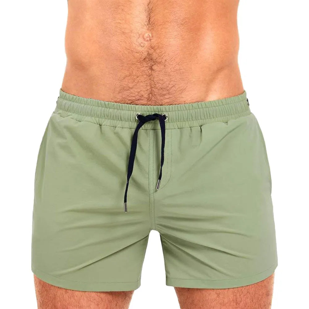Pair of solid colour sports shorts with mesh lining for swimming and fitness training.