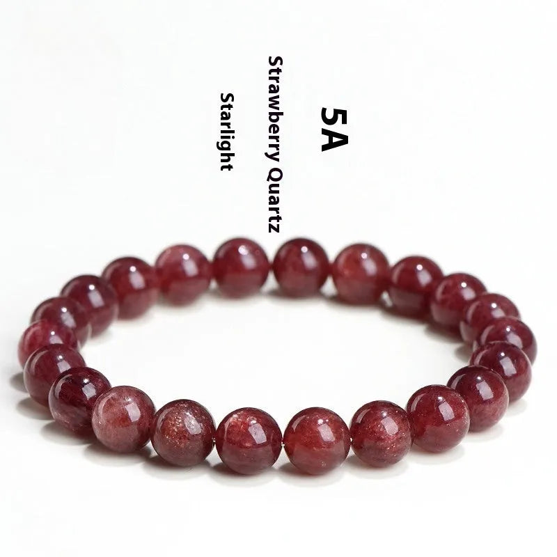 Natural cherry red strawberry quartz bracelet with geometric beads on a wrist
