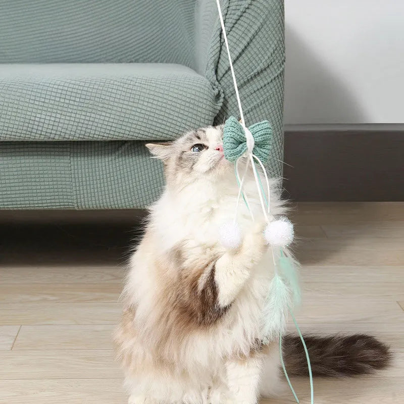 Blue cat teaser toy with long pole and feather attachments for interactive play