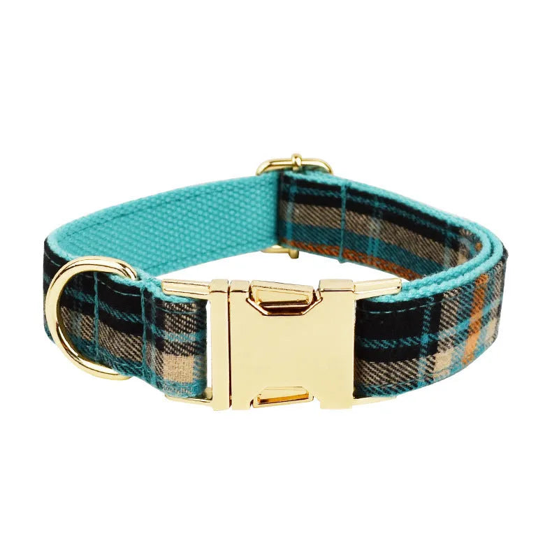 Green retro style cloth dog collar, leash, vest, and decorative bow set laid out flat.