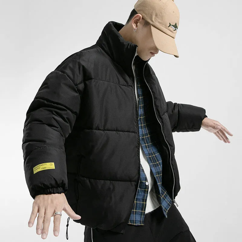 Men's stand collar padded jacket in black, polyester filling, zipper front, side slit pockets, straight hem, loose fit