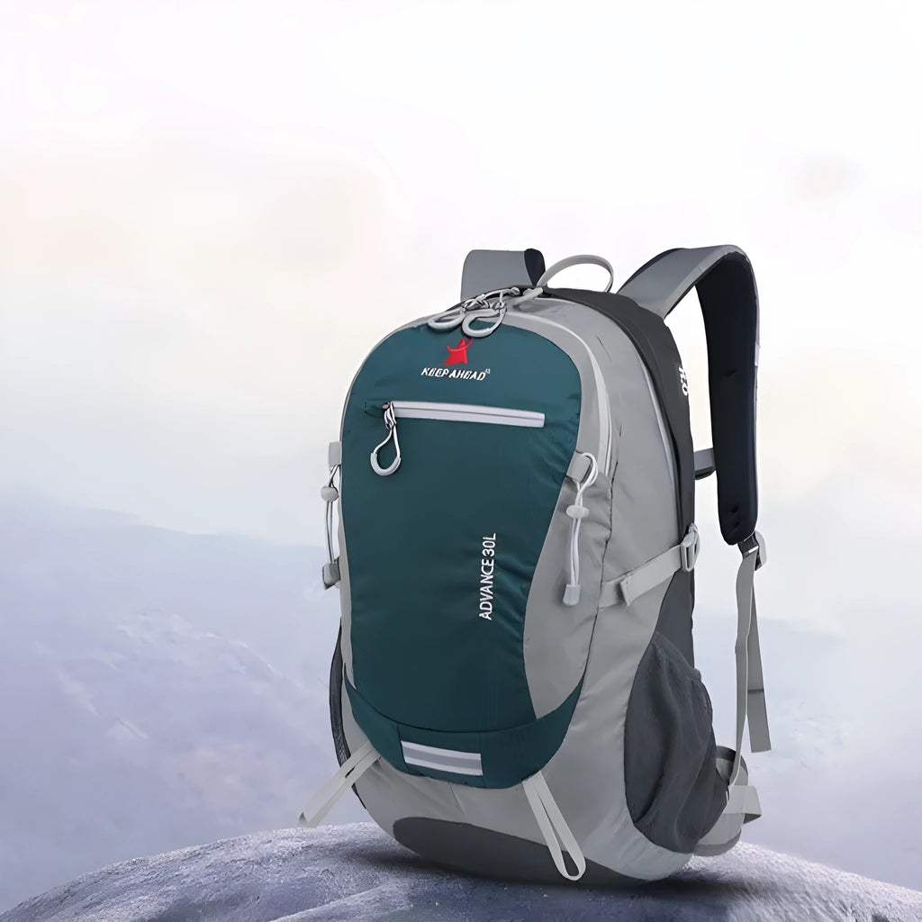 30 litre dark green nylon outdoor backpack with airpillow straps on a grey background.