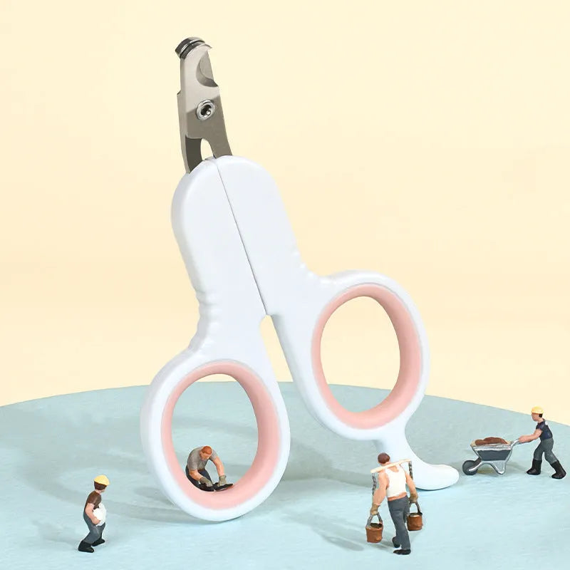Grey and pink pet nail clippers with curved tips and rubber-coated handle for cats and small dogs.