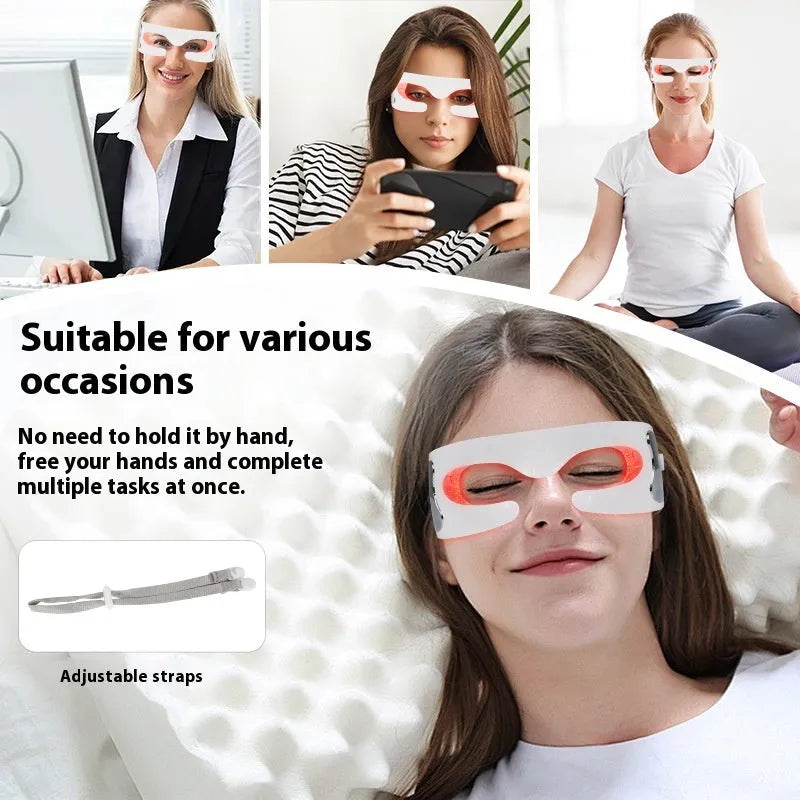 White portable rechargeable red light eye massager on a table