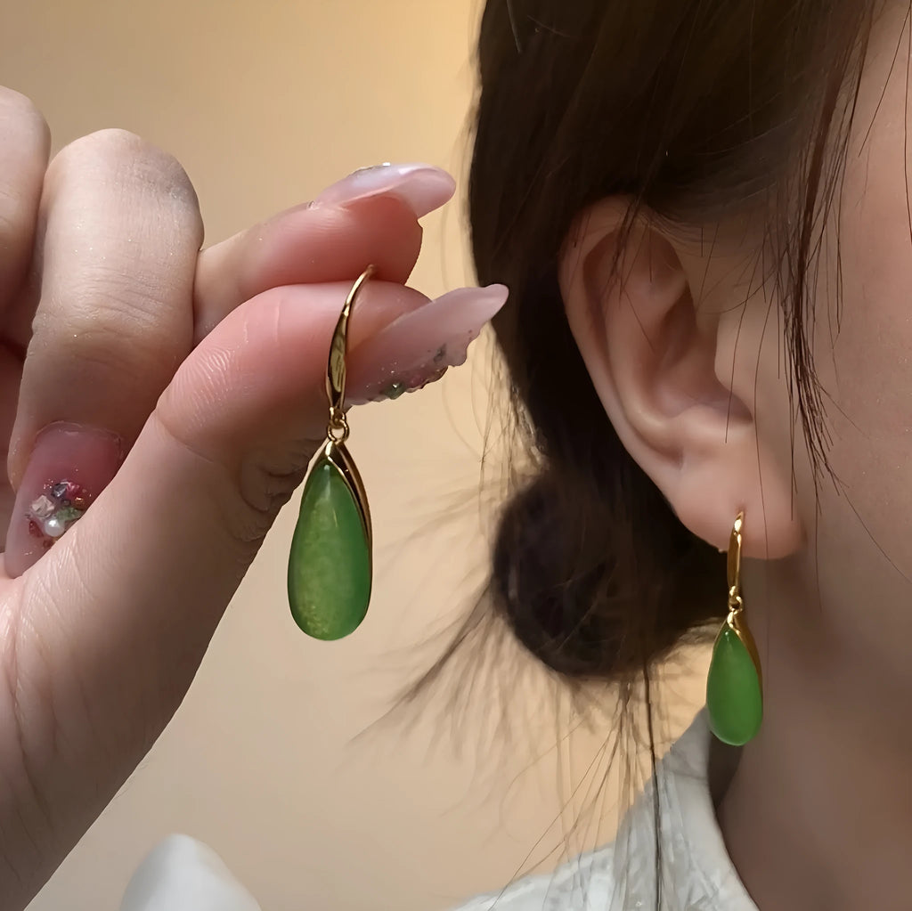 A pair of jade green geometric water droplet earrings in a Chinese style with an electroplated copper finish.