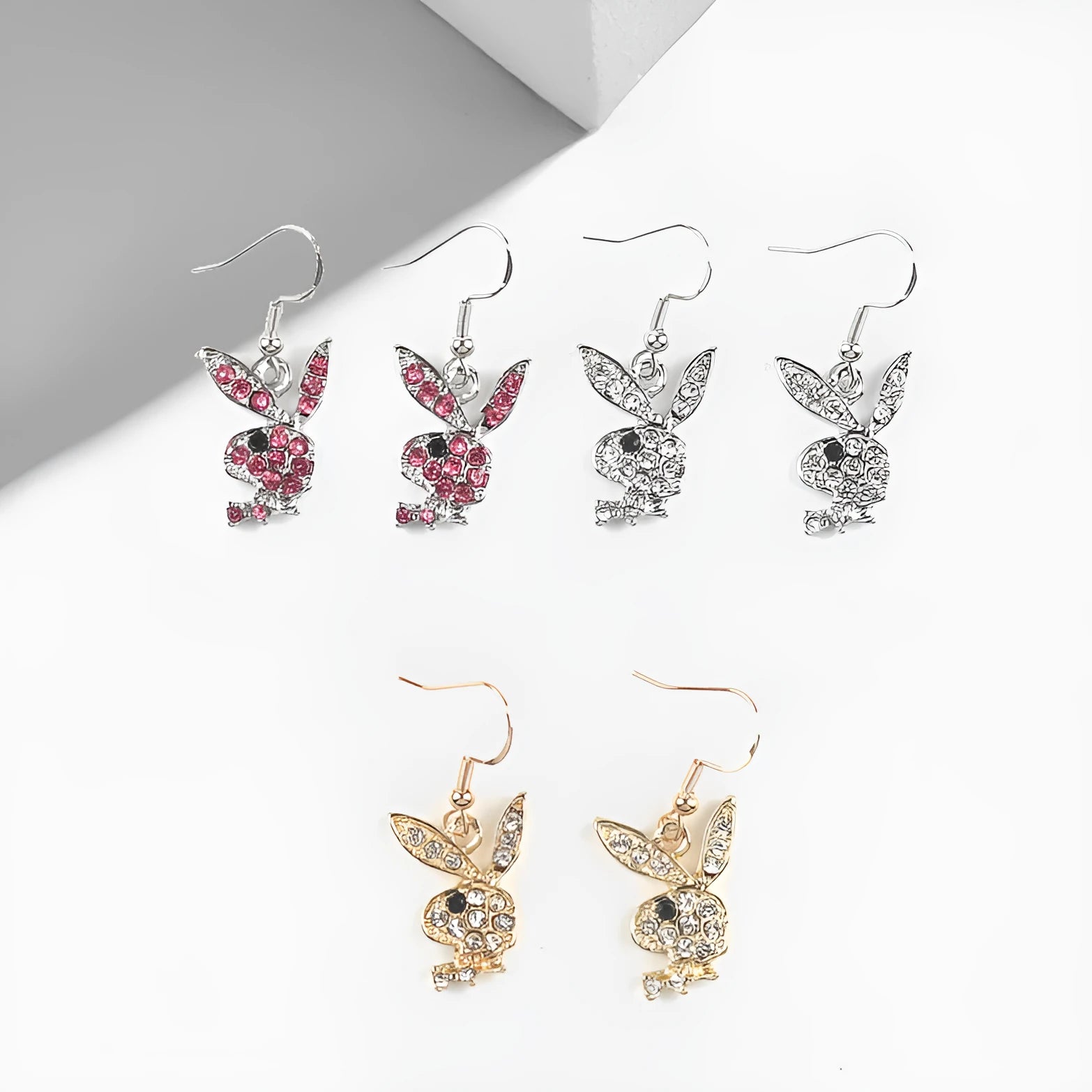 Cute cartoon rabbit stud earrings for women in gold, pink, and silver alloy.