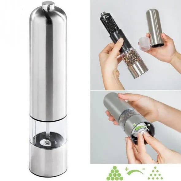 Tall stainless steel electric pepper grinder on a kitchen countertop.