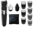 Rechargeable nose and beard hair clippers with a cleaning brush on a white background.