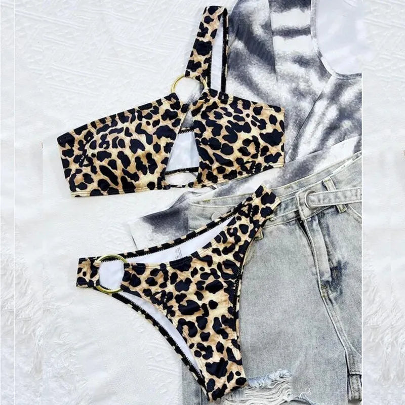 Women's leopard print polka dot bikini top and shorts set on a mannequin