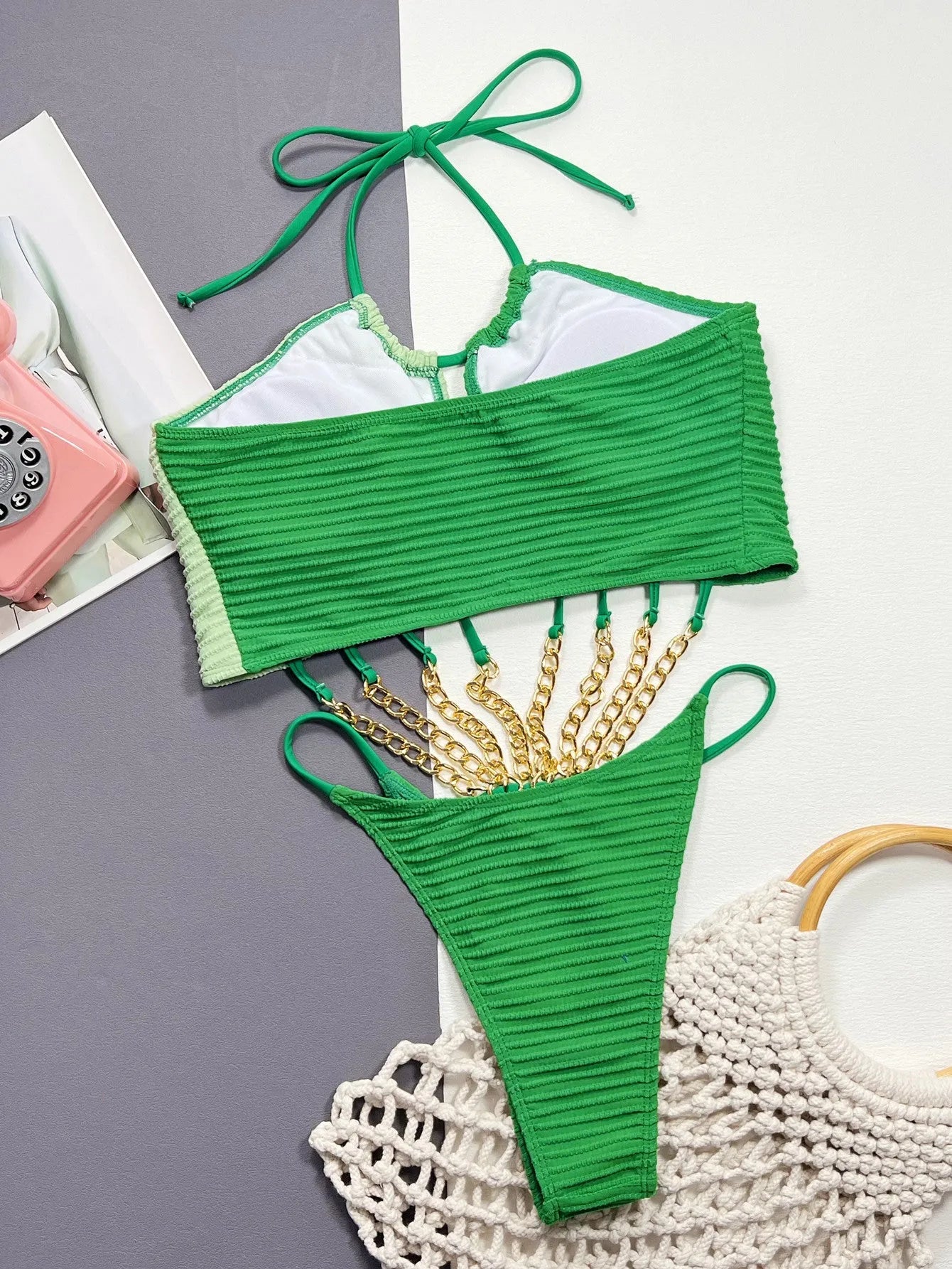 Green women's one-piece swimsuit with hollow cutout design in polyester fabric