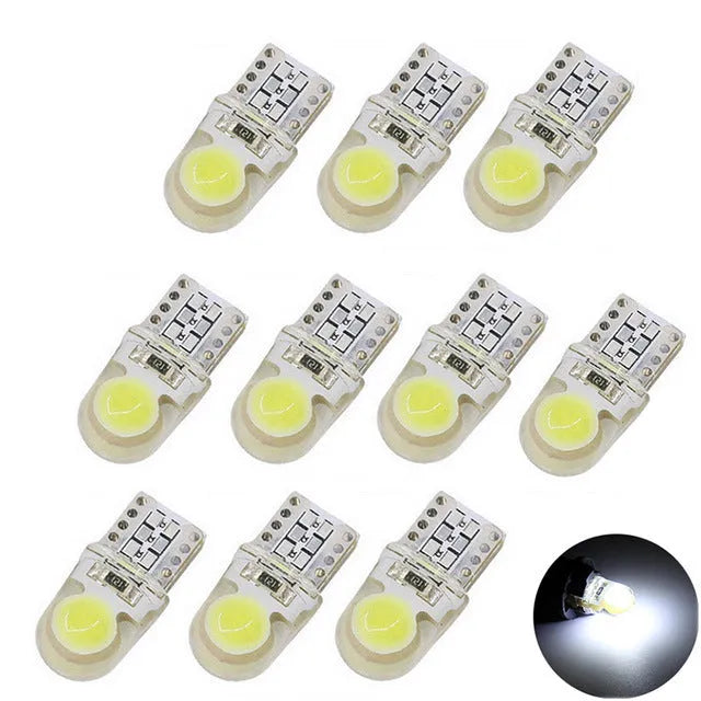 Pack of ten T10 wedge base LED bulbs for 12V car lighting in various colours on a white background.