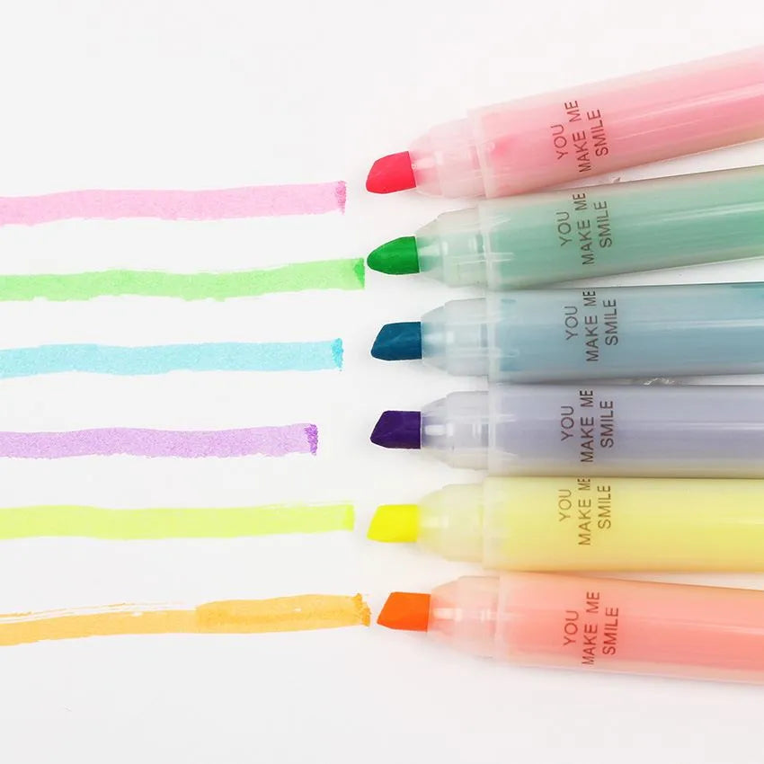 Set of six plastic highlighter pens with oblique chisel tips in different fluorescent colours.