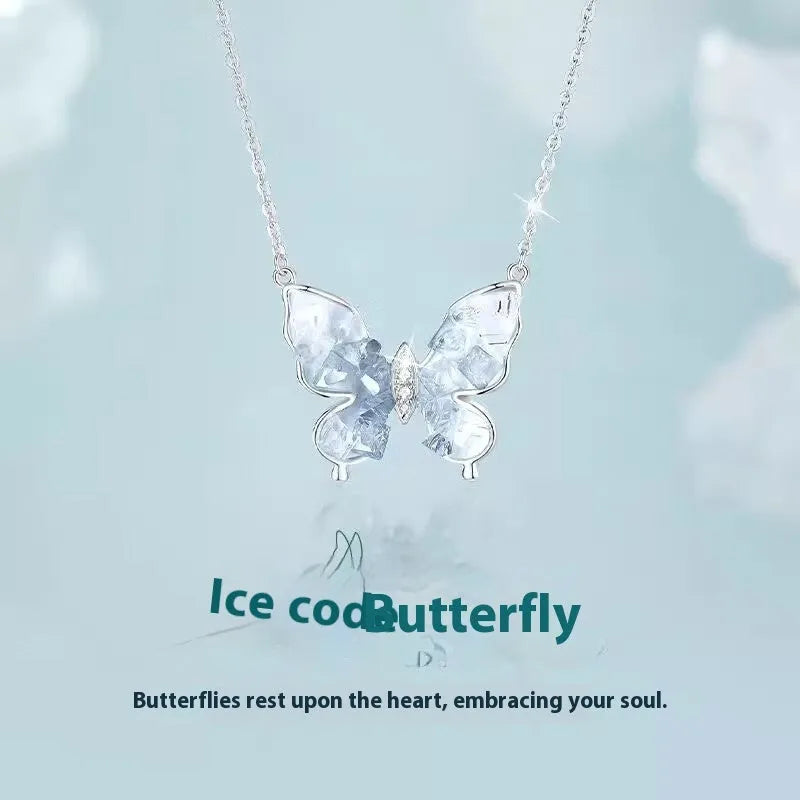 Close-up of a silver Bingyu butterfly pendant necklace on an adjustable O-ring chain.