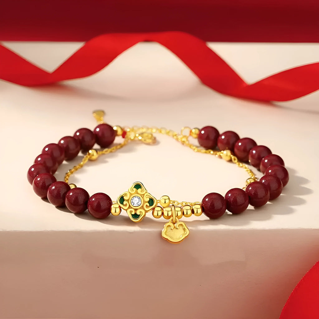 Sterling silver women's bracelet with geometric Ruyi and Xiangyun Chinese motifs and cinnabar red flower detailing