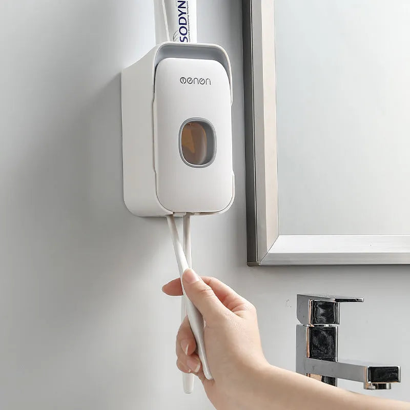 Wall-mounted automatic toothpaste dispenser with touch sensor and LED light in blue colour