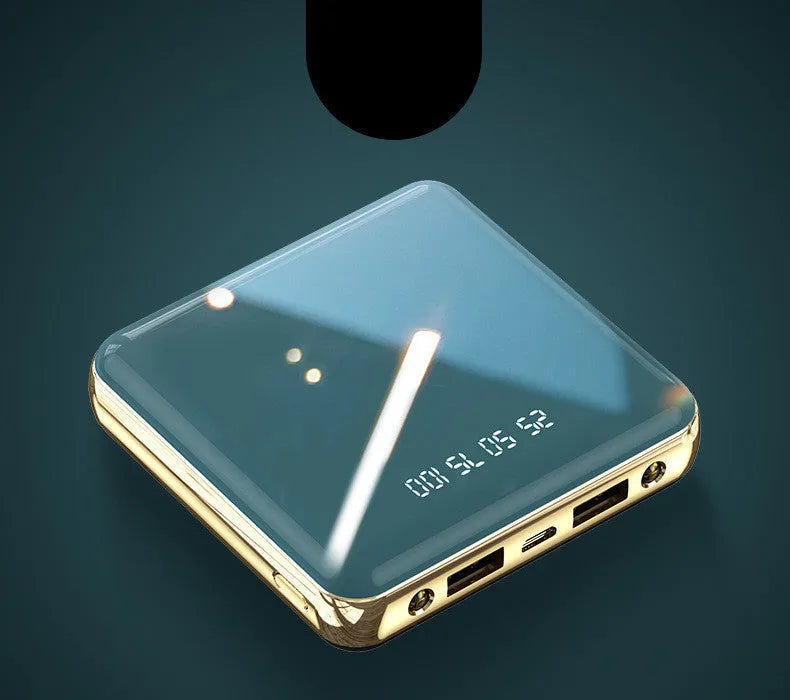 Blue cylindrical aluminium shell mini power bank showing USB ports and compact 83mm size