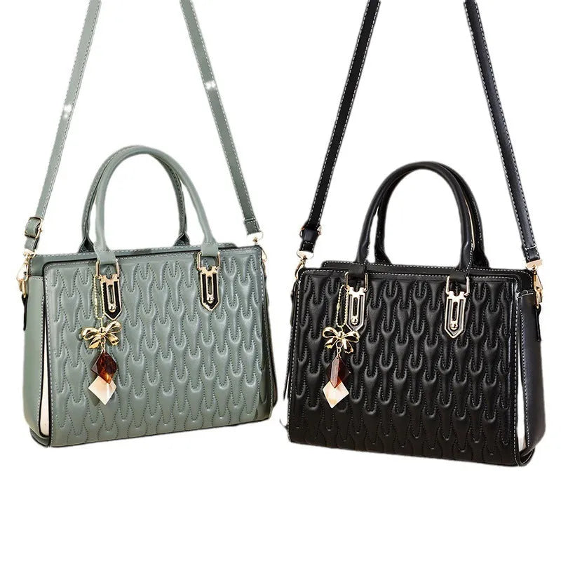 Women's large black PU shoulder messenger bag with front pocket and shoulder strap.