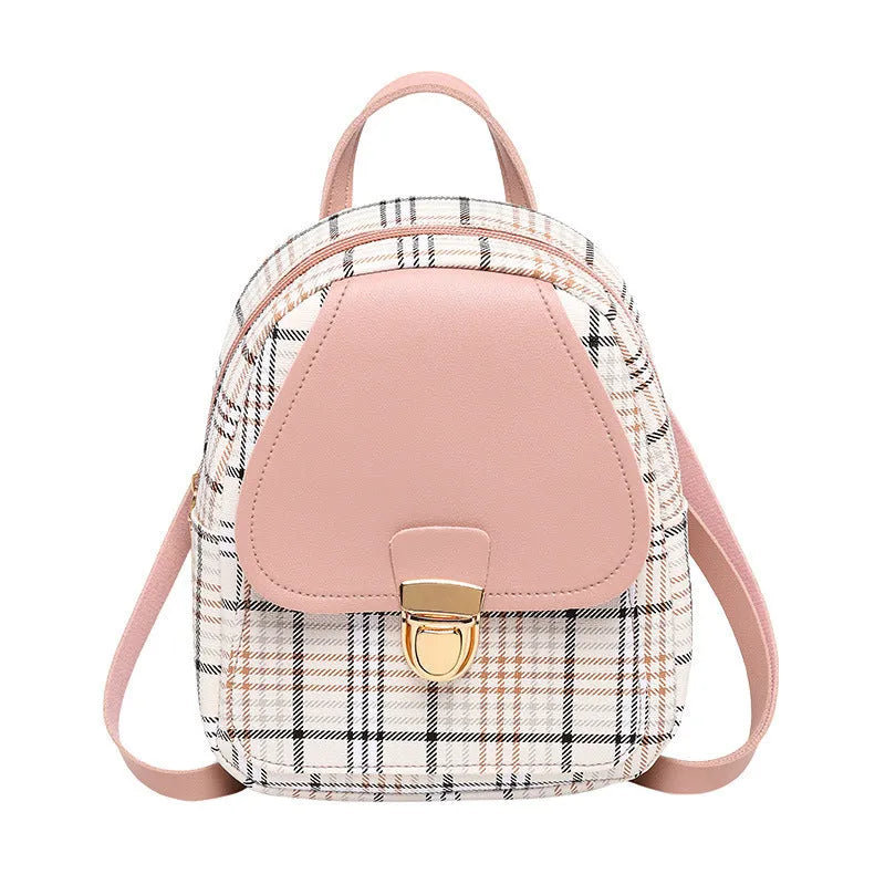 A one shoulder diagonal phone bag made from black PU fabric, shown being worn crossbody.