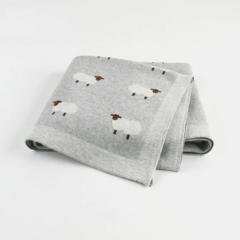 100x80cm grey and pink baby sheepskin blanket made from 100% cotton fabric laid flat.