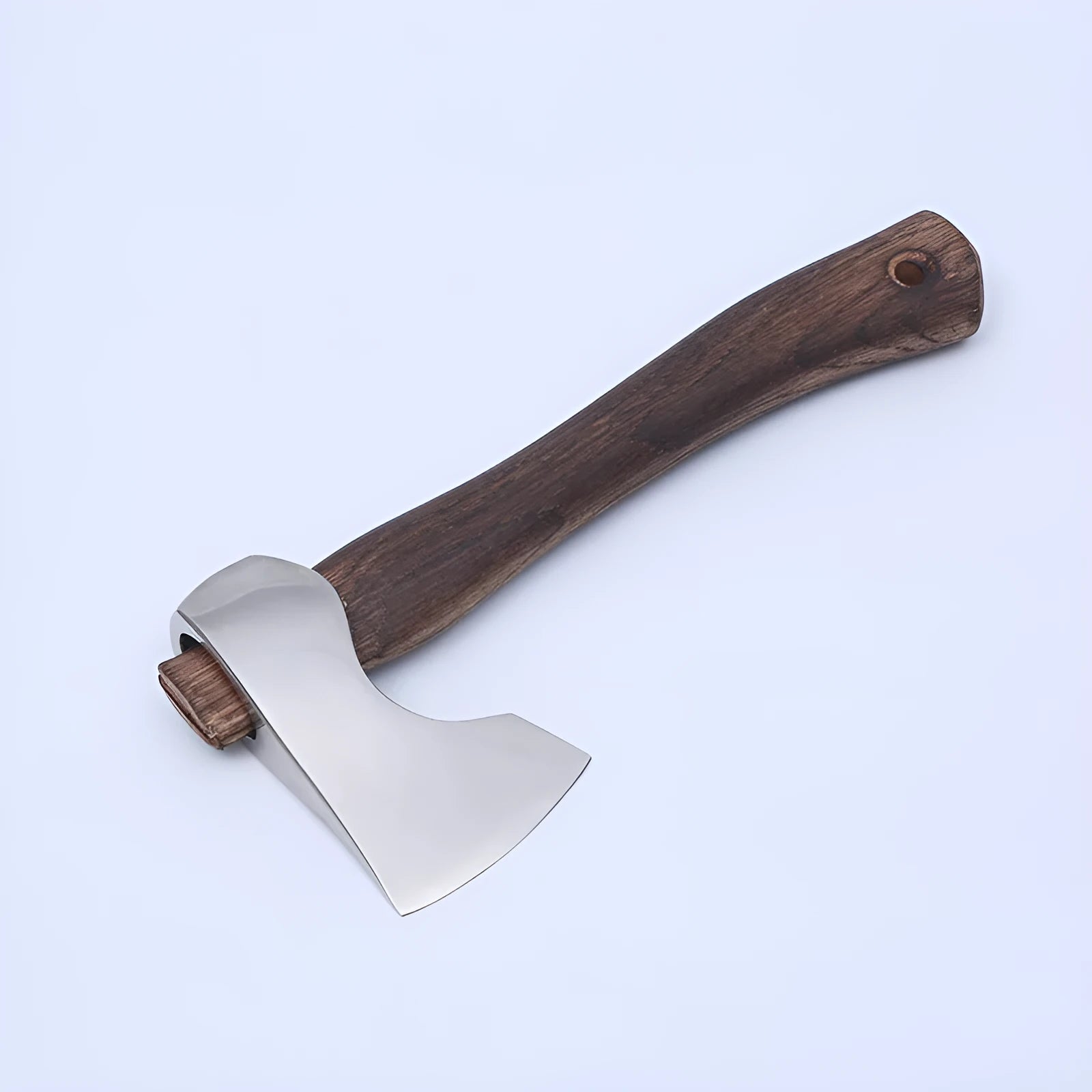 Camping axe with high carbon steel head and wooden handle on a white background.