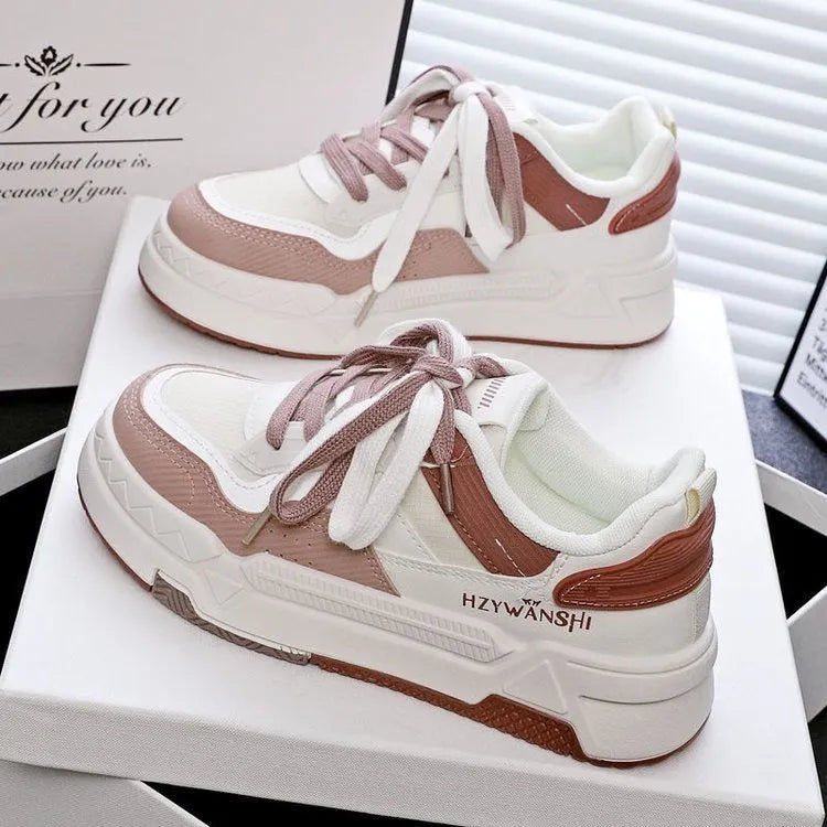 Children's beige thick-soled board shoes with cross shoulder strap lacing on a white background.