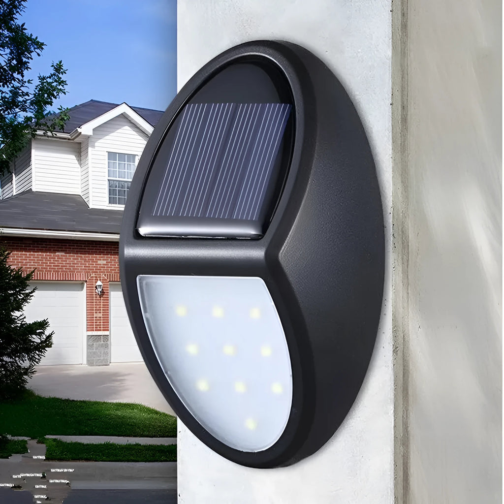 Black rectangular solar-powered LED wall light with a solar panel on top.