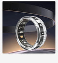 Diamond-inlaid smart ring in silver and gold colours on finger, showing health monitoring display.