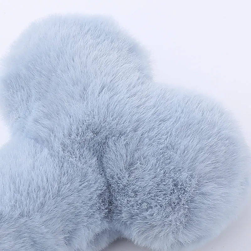 Cute plush love bone dog toy with a squeaker in blue, pink, and yellow colours.