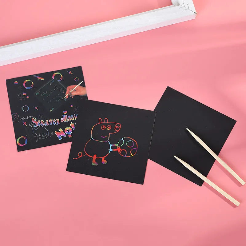 Scratch painting activity set showing colourful trumpet design on paper sheets in colour gift box