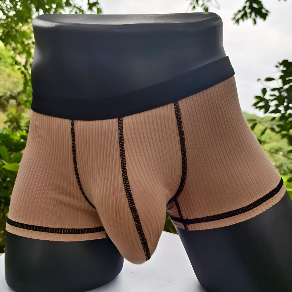 Men's solid colour boxer shorts in thin fabric, shown in army green, highlighting breathable and body-shaping design.