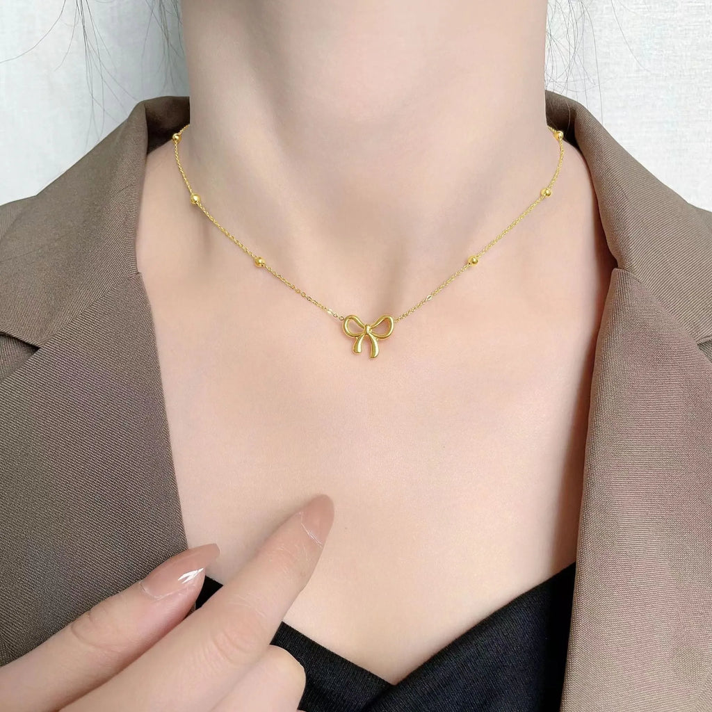 Gold bow necklace on cross chain with 41-50cm perimeter for women's office fashion