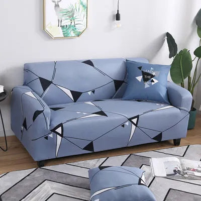 Geometric pattern stretch sofa slipcover and matching cushion cover on a double seat sofa.